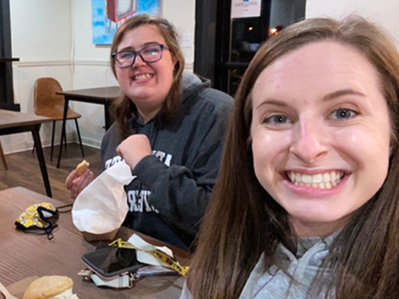Two college students at a table