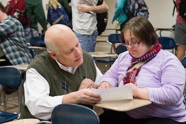 Professor working with SDAP scholar in the classroom